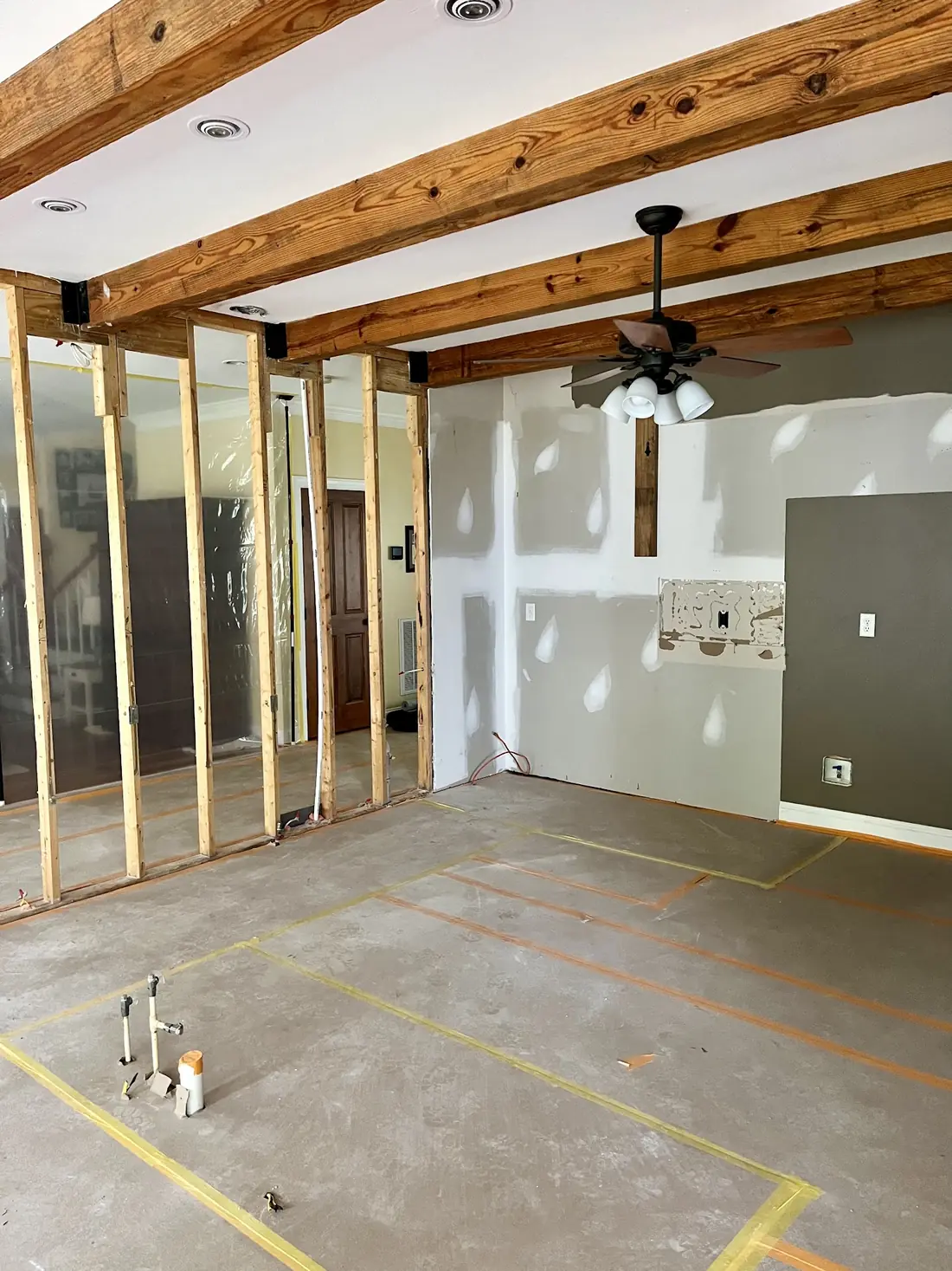 Load-bearing wall opened to studs during a selective demolition job