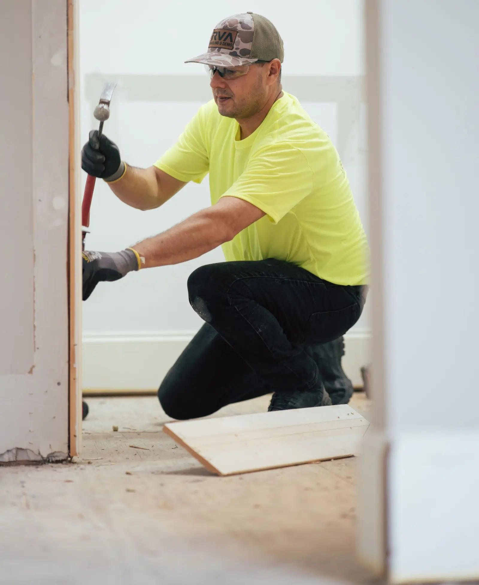 RVA Hauling & Demo worker installing trim during a Richmond home renovation